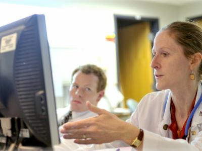 Researchers looking at computer screen