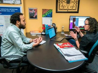 Derek Jones (left), a research assistant who works with Sally Ellingson (right), spent the summer at the Lawrence Berkeley National Lab working on a computational model that predicts whether or not a drug will bind to multiple proteins.