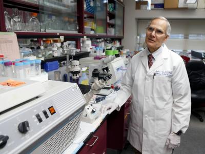 niversity of Kentucky pathologist Dr. Charles Lutz talked in his lab about his experience with prostate cancer at University of Kentucky Hospital After he was diagnosed, he started working on a cure for that cancer. Charles Bertram cbertram@herald-leader.com