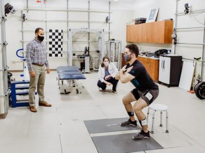 Michael Samaan (left) and Mary Sheppard (center) prepare for the study in the UK Biodynamics Lab with graduate assistant Walter Menke (right).