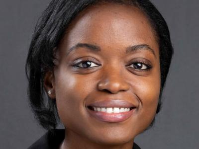 Headshot of Mautin Barry-Hundeyin, MD. She's a young Black woman with chin-length, straight hair and she's smiling at the camera. She's wearing a black suit jacket. 