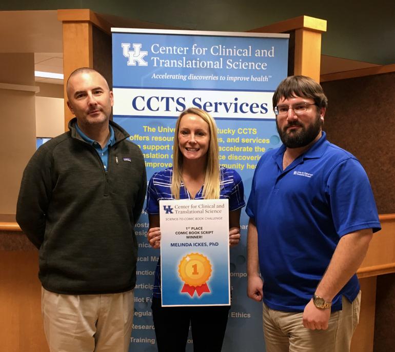 Ickes, center, was selected as winner of the CCTS Science Communication Comic Book Challenge. She is joined by Joel Thompson, PhD, research development director, and Bryan Sanders, marketing assistant and illustrator. 
