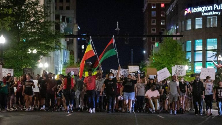 Protesters march through the streets of downtown during the 11th night of protesting police violence in Lexington, Ky., Monday, June 8, 2020. photo by SILAS WALKER, LEXINGTON HERALD-LEADER