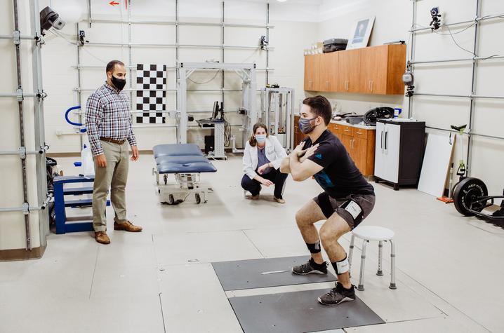 Michael Samaan (left) and Mary Sheppard (center) prepare for the study in the UK Biodynamics Lab with graduate assistant Walter Menke (right).