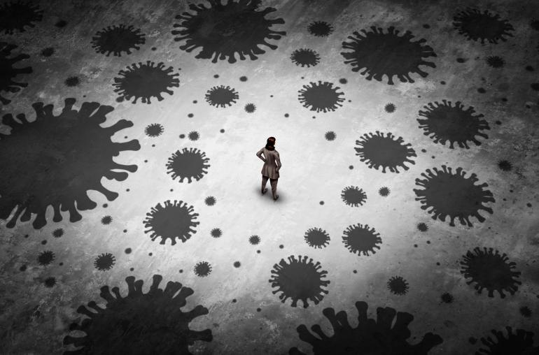 Illustrated black and white image of an isolated woman standing alone surrounded by covid molecules