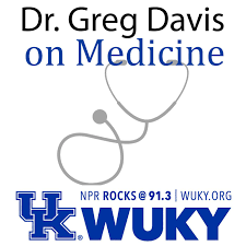Logo that says across the top "Dr. Greg Davis on Medicine" and at the bottom is a blue University of Kentucky "UK" logo with WUKY written beside it. In the center of the image is a light gray silhouette of a stethoscope. 