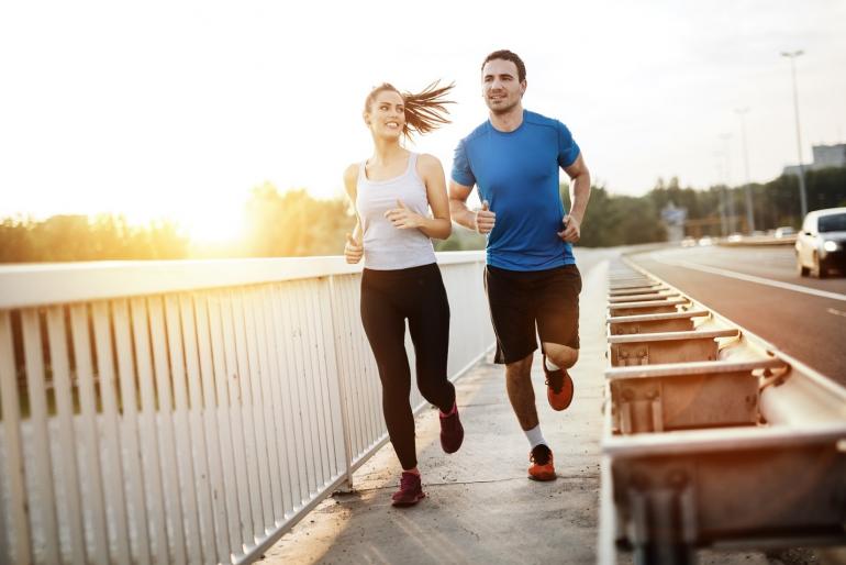 Two Adults Running Together