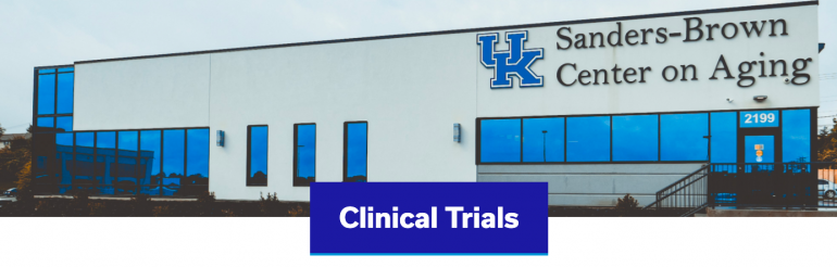 Photo of the exterior of the UK Sanders Brown Center on Aging. Below, centered in a blue text box are the words Clinical Trials. 