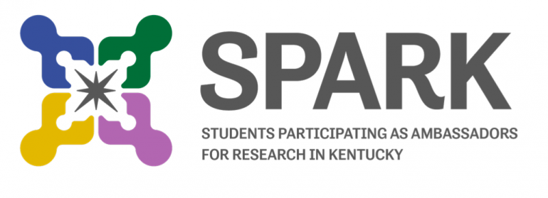 Logo for the SPARK program: On the right is a stylized square star shape in green, blue, purple and yellow. To the left is the word SPARK in large, bold, capital letters, under which reads "Students Participating as Ambassadors for Research in Kentucky"