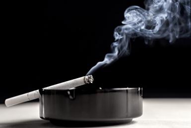 lit cigarette in ashtray