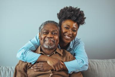 Black man and women hugging