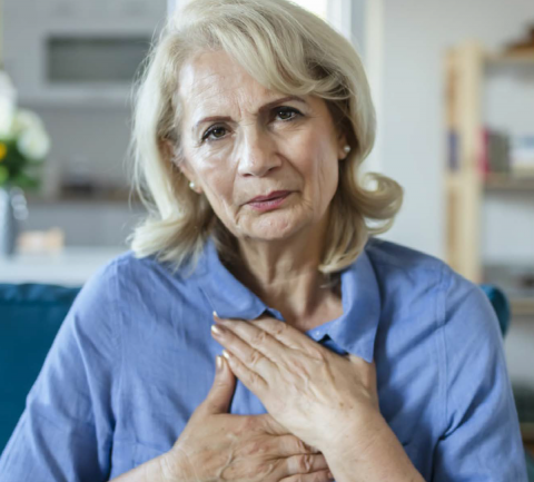 woman holding chest