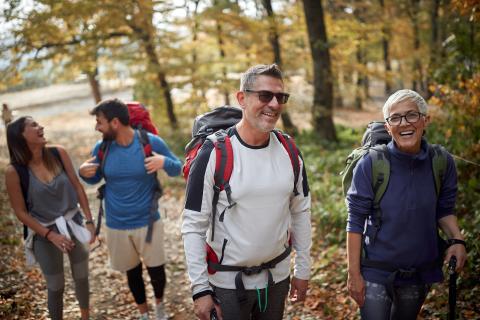 A group of men and women hiking. 