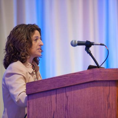 Nancy Schoenberg speaking during 2014 conference