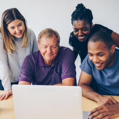 Group of people using a computer